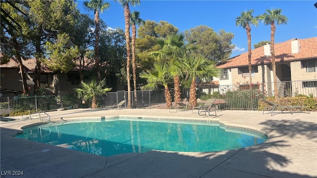 view of swimming pool with a patio area