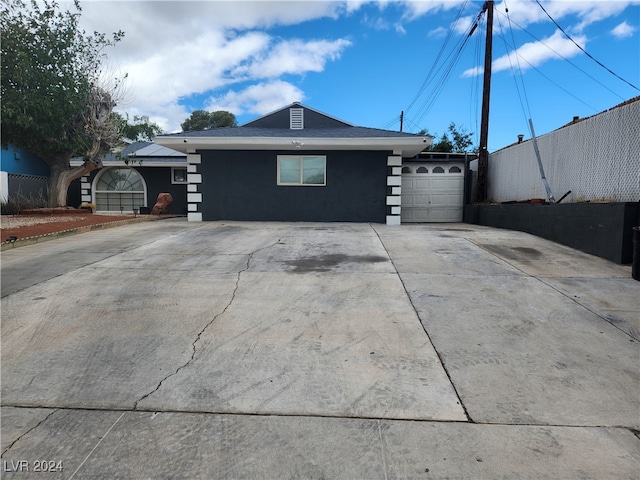 view of side of home with a garage