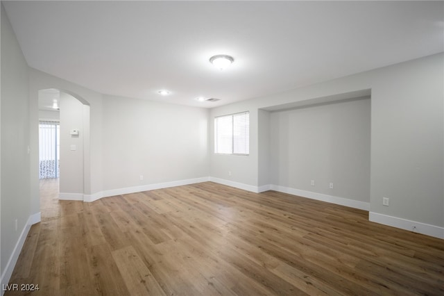 spare room featuring hardwood / wood-style floors