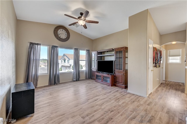 unfurnished living room with vaulted ceiling, light wood-type flooring, and ceiling fan