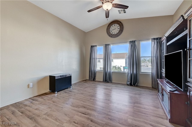 unfurnished living room featuring light hardwood / wood-style flooring, lofted ceiling, and ceiling fan