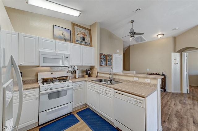 kitchen featuring light hardwood / wood-style floors, kitchen peninsula, sink, white cabinetry, and white appliances