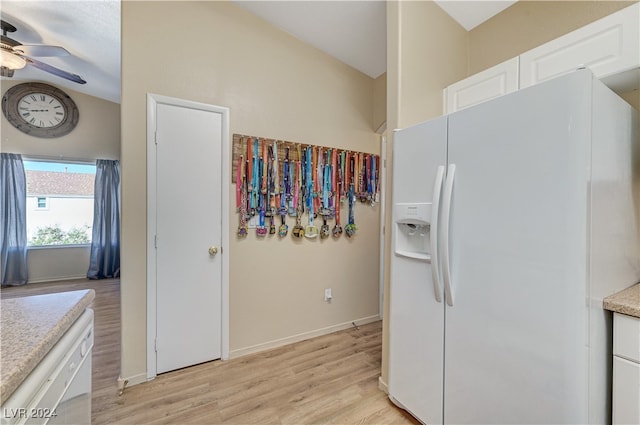 kitchen with white cabinetry, light hardwood / wood-style flooring, white appliances, and ceiling fan