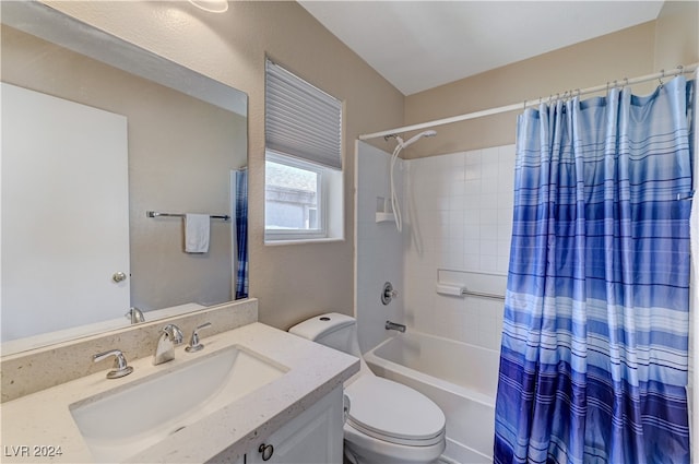 full bathroom with vanity, shower / bath combination with curtain, and toilet