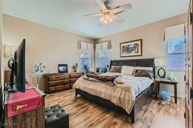 bedroom featuring light hardwood / wood-style floors and ceiling fan