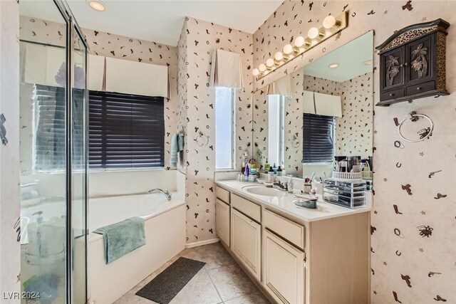 bathroom featuring vanity, shower with separate bathtub, and tile patterned flooring