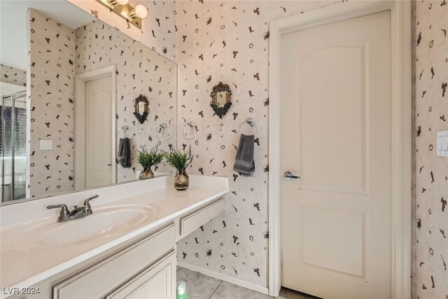 bathroom featuring vanity and tile patterned flooring