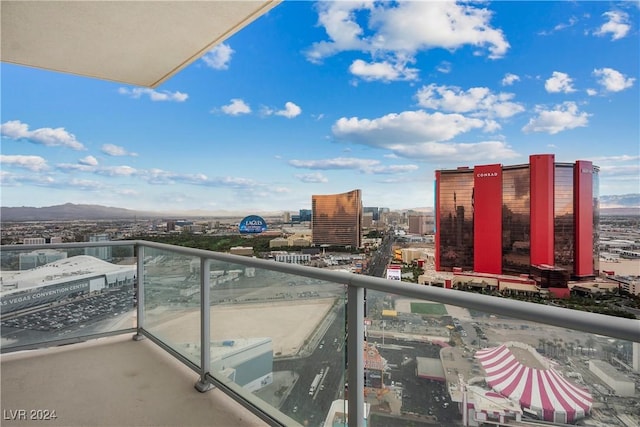 balcony featuring a view of city and a mountain view