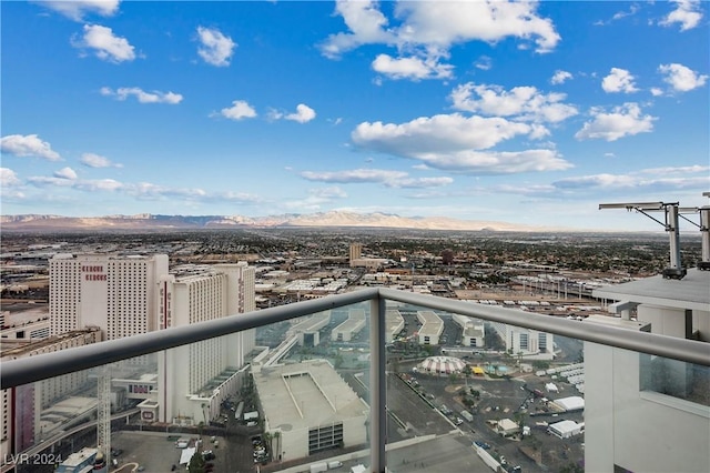 balcony with a view of city and a mountain view