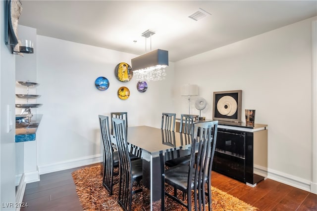 dining area featuring dark hardwood / wood-style flooring