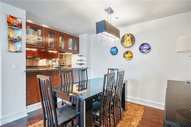 dining room with dark wood-type flooring