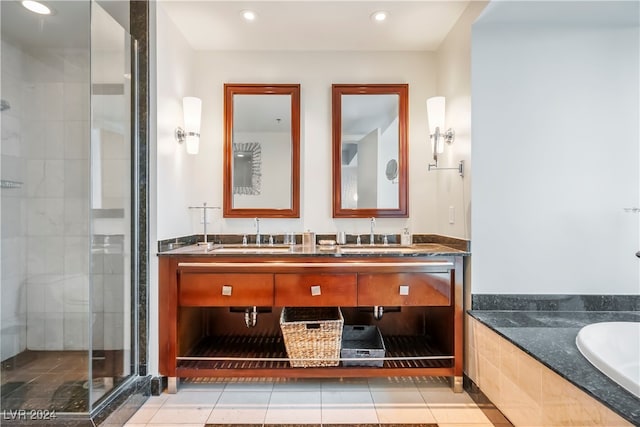 bathroom featuring vanity, plus walk in shower, and tile patterned flooring