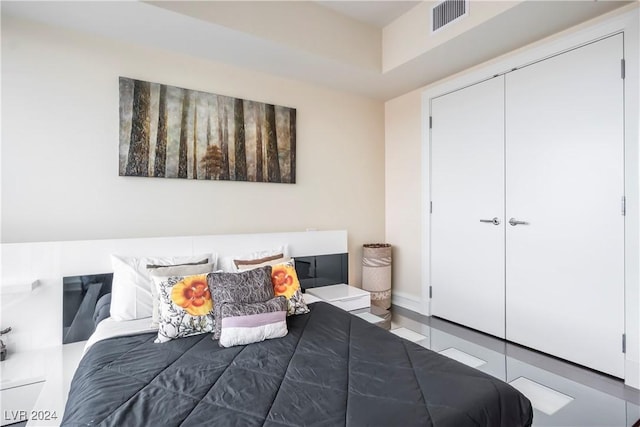 bedroom featuring visible vents and a closet