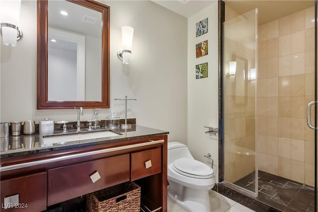 bathroom featuring tile patterned flooring, vanity, toilet, a shower stall, and visible vents