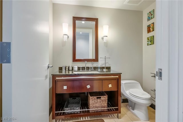 bathroom featuring toilet, visible vents, tile patterned flooring, and vanity