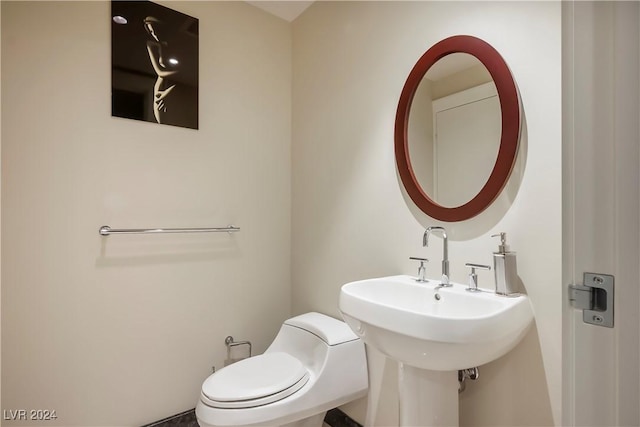 half bath featuring toilet