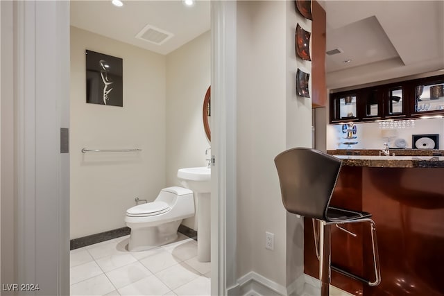 bathroom featuring tile patterned floors and toilet