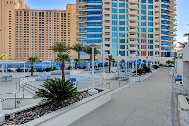 view of building exterior featuring a community pool