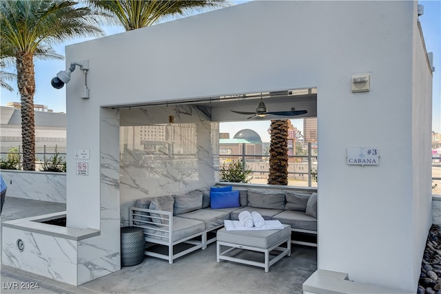 view of patio with ceiling fan and an outdoor hangout area