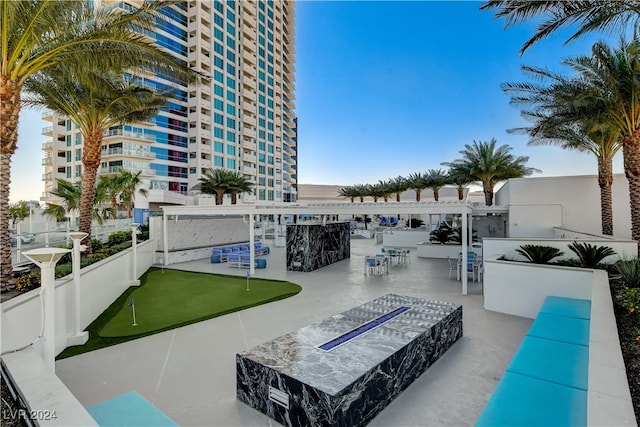 view of pool with a bar and a patio area