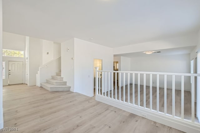 unfurnished room with a wealth of natural light and light wood-type flooring