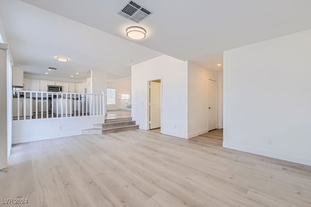 unfurnished room featuring light wood-type flooring