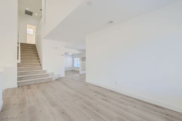 unfurnished living room featuring light hardwood / wood-style flooring