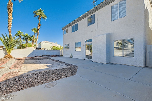 back of house with a patio area