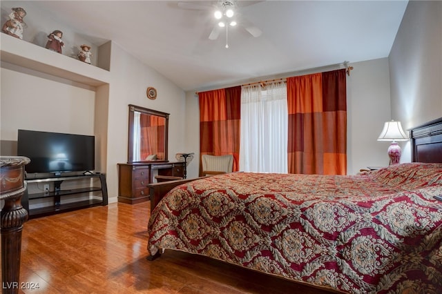 bedroom featuring vaulted ceiling, hardwood / wood-style flooring, and ceiling fan