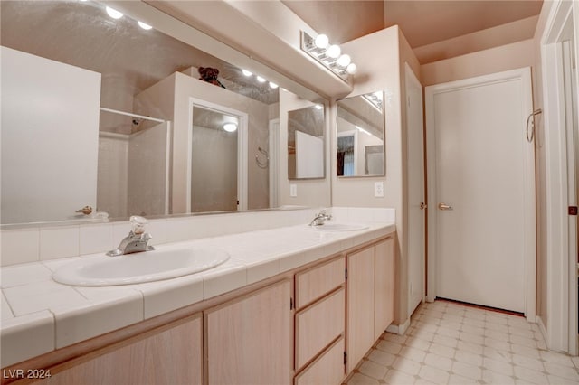 bathroom with vanity and walk in shower