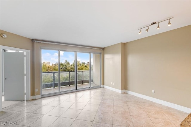 unfurnished room featuring light tile patterned flooring