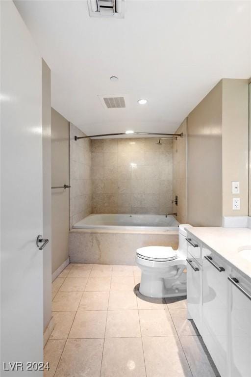 full bathroom with tile patterned floors, vanity, toilet, and tiled shower / bath