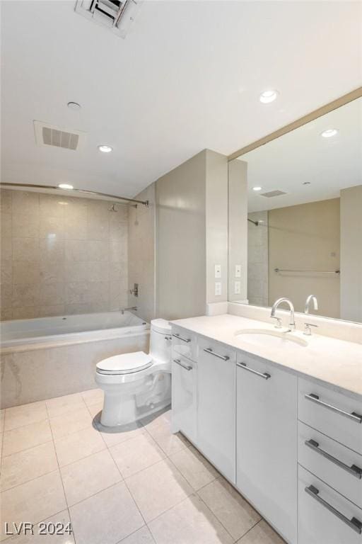 full bathroom featuring toilet, tile patterned flooring, vanity, and tiled shower / bath