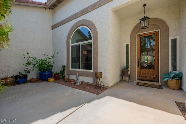 doorway to property with a patio