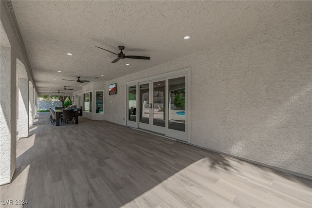 view of patio featuring french doors and ceiling fan