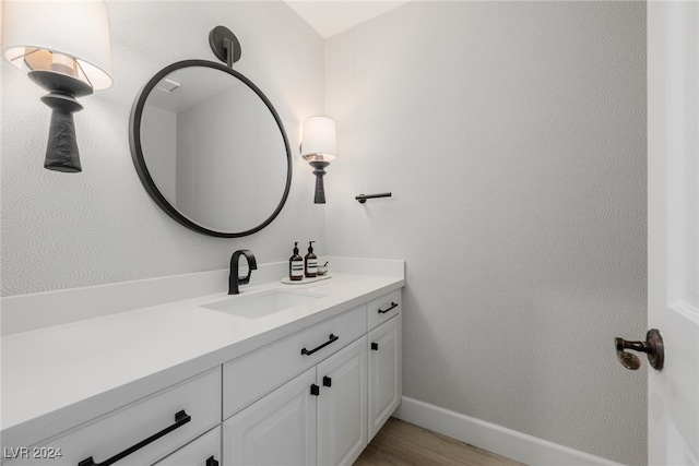 bathroom featuring vanity and hardwood / wood-style floors