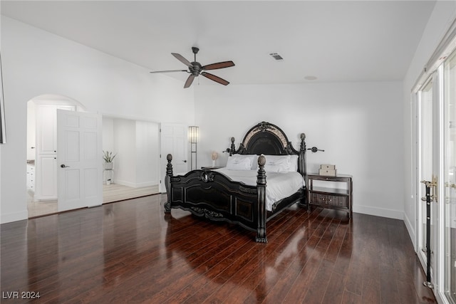 bedroom featuring dark wood-type flooring, ceiling fan, and vaulted ceiling