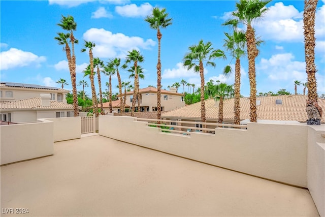 view of patio featuring a balcony