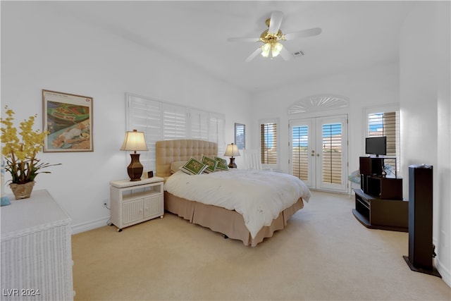 bedroom featuring french doors, ceiling fan, access to outside, and light colored carpet