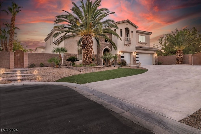 mediterranean / spanish-style home featuring a garage