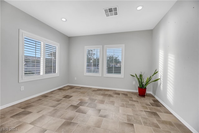 spare room featuring a wealth of natural light