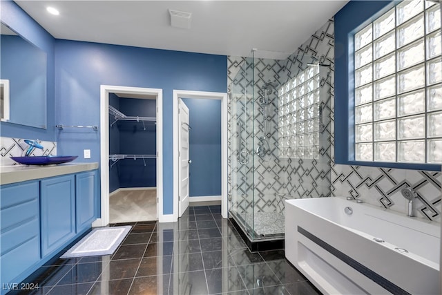 bathroom with vanity and plus walk in shower