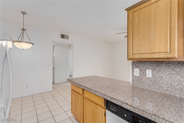 kitchen featuring light brown cabinets, light tile patterned floors, backsplash, white refrigerator, and stainless steel dishwasher