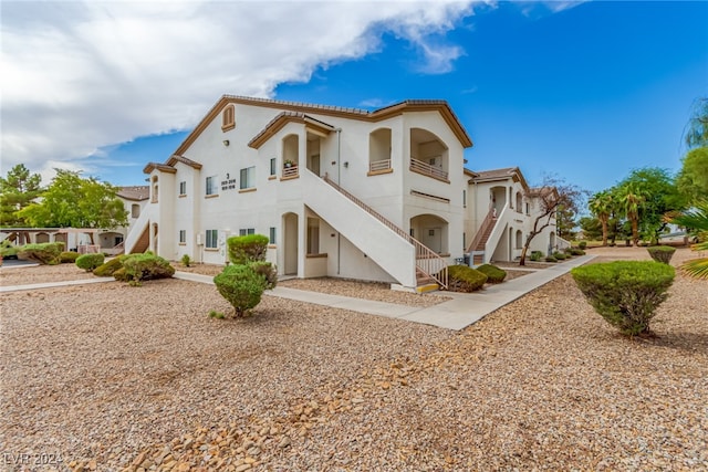 view of front of home with a balcony