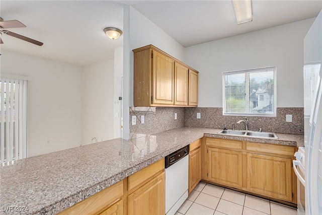 kitchen featuring decorative backsplash, sink, light tile patterned flooring, white appliances, and ceiling fan