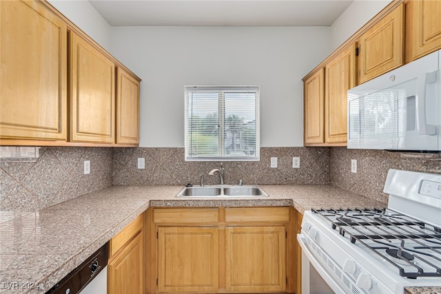 kitchen featuring tasteful backsplash, sink, and white appliances