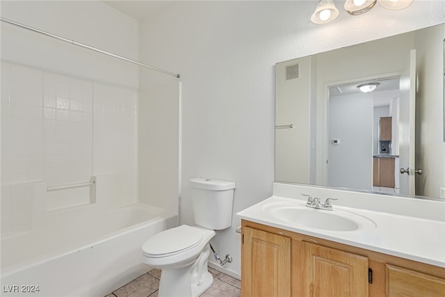 full bathroom featuring toilet,  shower combination, vanity, and tile patterned floors