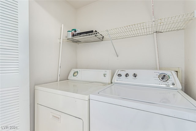 laundry room with washing machine and clothes dryer