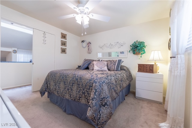 bedroom featuring ceiling fan and light colored carpet