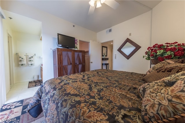 tiled bedroom with ceiling fan